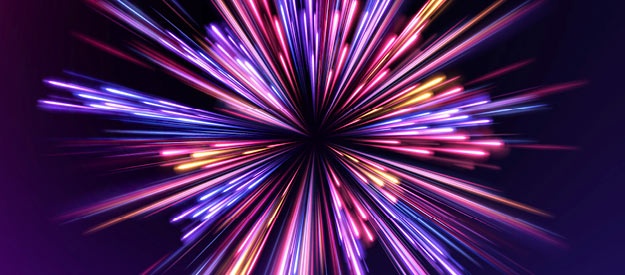 Abstract burst of multicolored light streaks radiating outward from a central point on a dark background, resembling fireworks or an energy explosion.